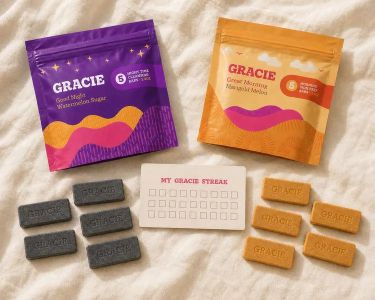 The Gracie Starter Kit: gold Great Morning pouch, purple Good Night pouch, five gold bars, five charcoal bars, and the printed Streak Card